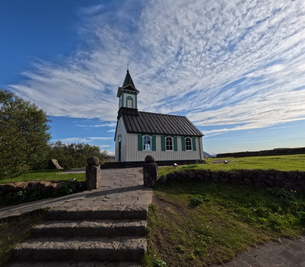 tourist visiting historic church in thingvellir national park golden circle iceland