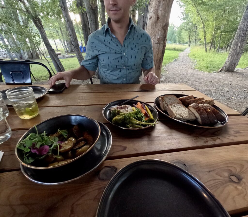 tourist having dinner at bodhi farms in bozeman montana