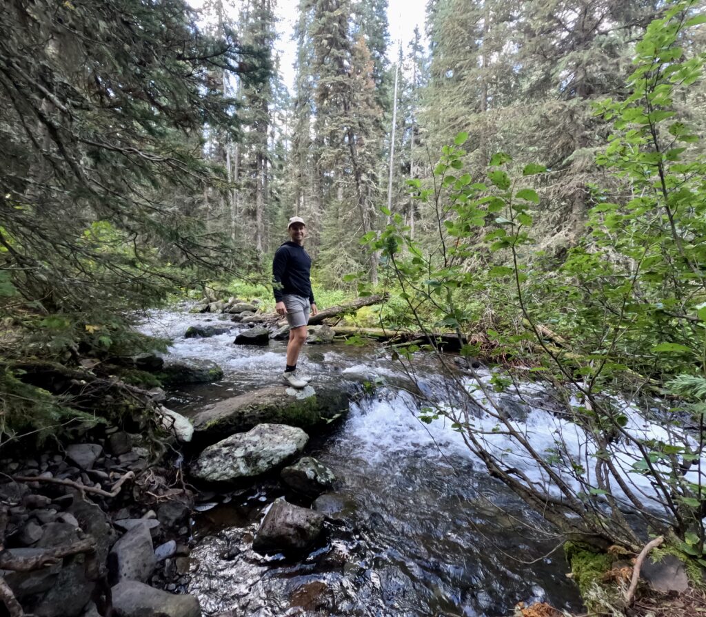 tourist couple hiking grotto falls trail in montana